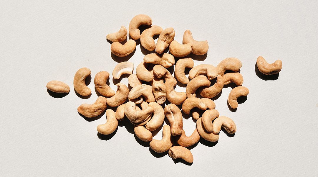Cashew nuts on a white background.