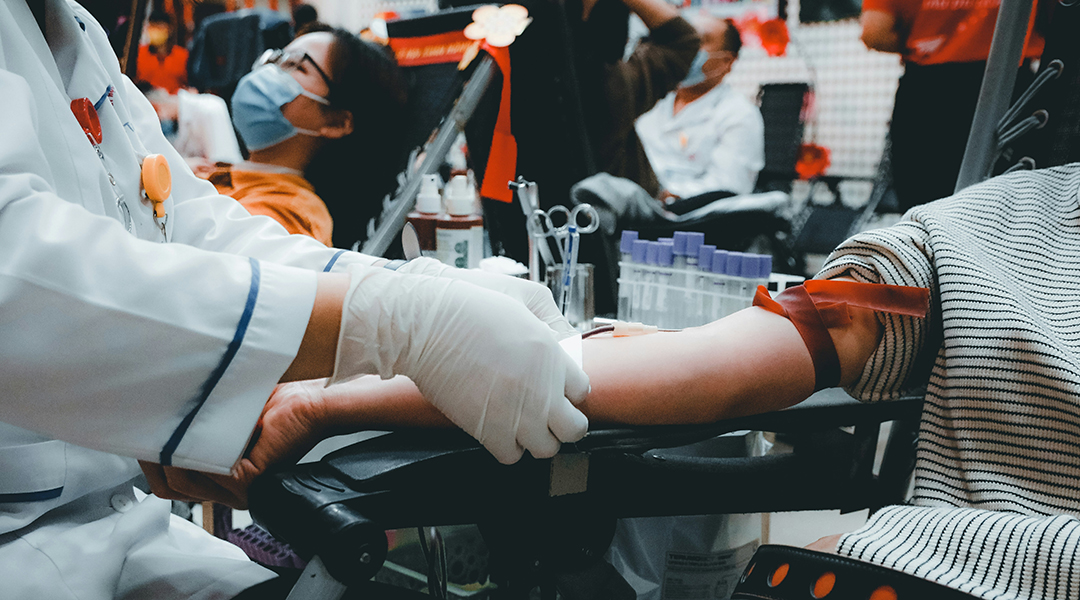 A person donating blood at a clinic.