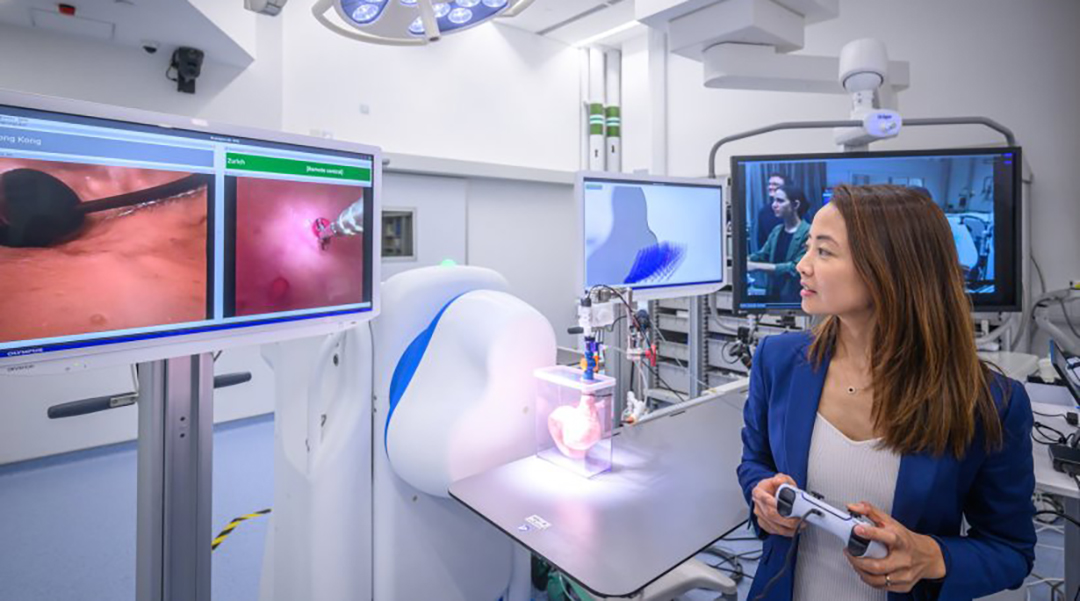 A researcher operating a robotic endoscope.