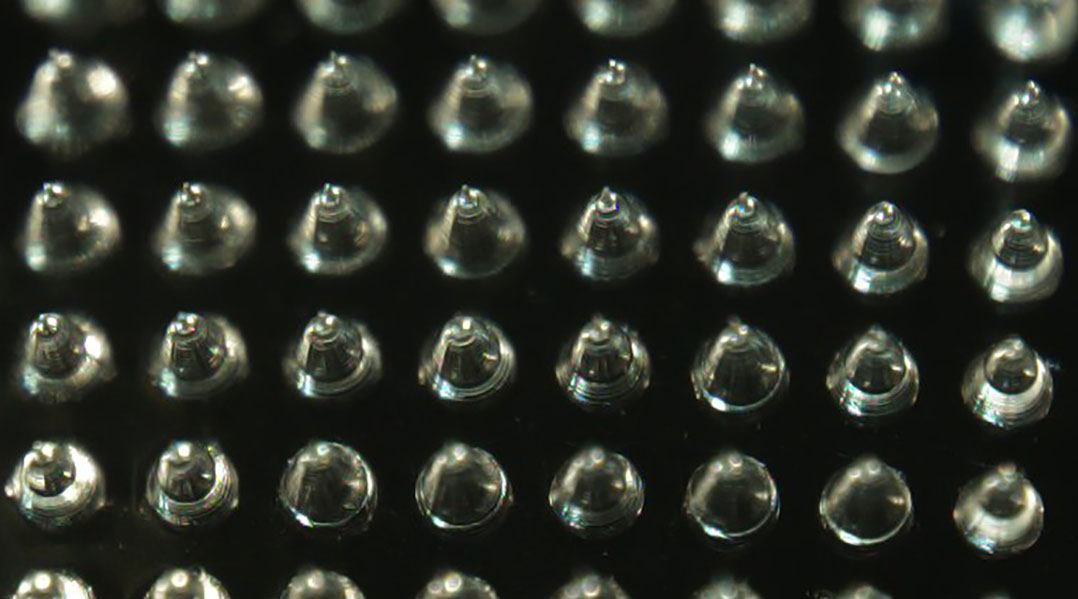 An array of microneedles used in a wound-healing patch.