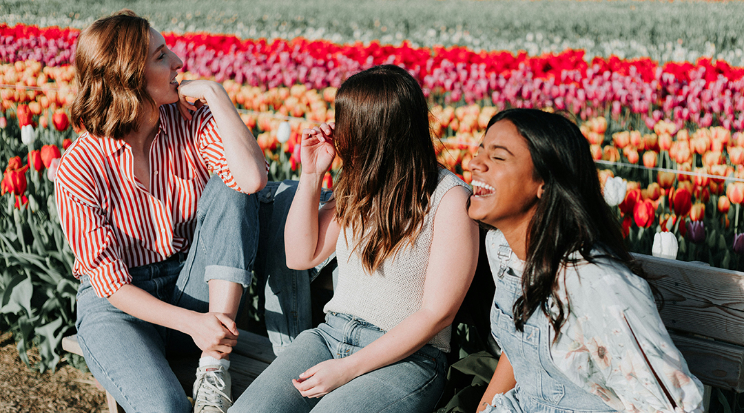 A group of women in a tulip field.